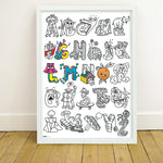 OMY ABC — child colouring on the poster and learning the alphabet