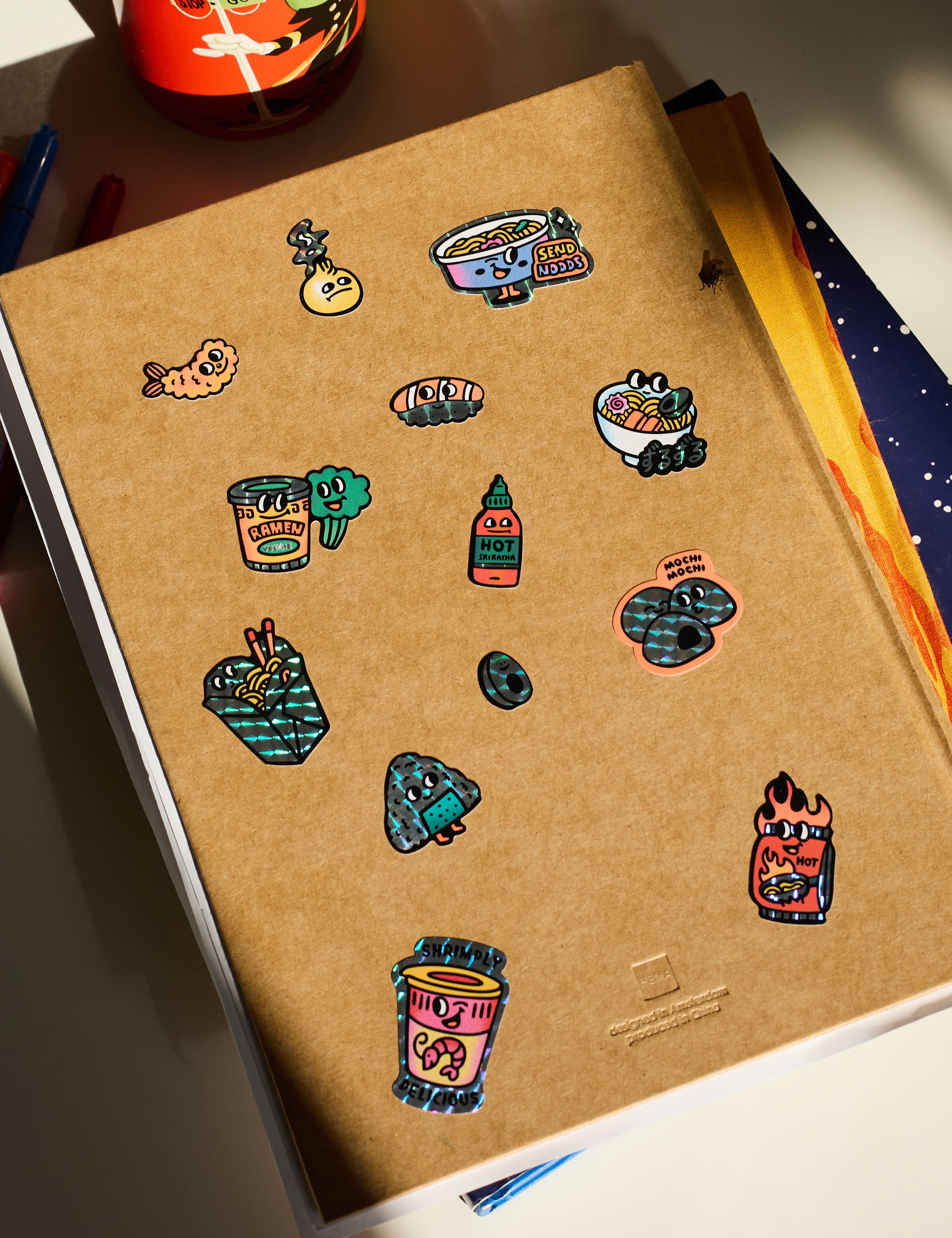 OMY Big Kitty - stickers applied on a notebook for personalisation