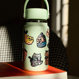 OMY Big Kitty - lifestyle scene with stickers on personal items