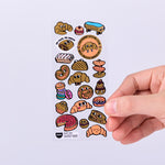 OMY Iconic Croissant — stickers applied on a notebook